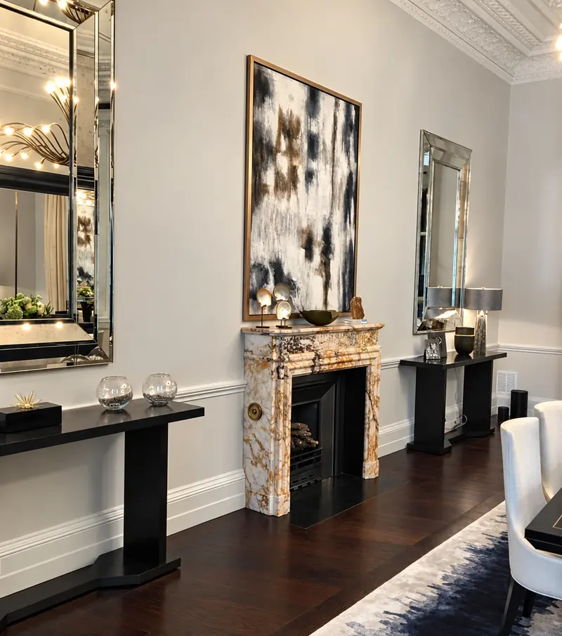 Marble fireplace, mirrored panelling and restored cornicing in a London dining room decorated by Whitecrest